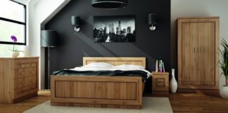 Zakup łóżka – na co zwracać uwagę? Drewniane łóżko w sypialni